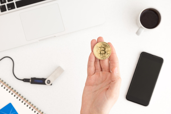 Gold coin with a bitcoin symbol.